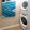 Front Loader Washer and Dryer in lighted laundry room with built-in shelves
